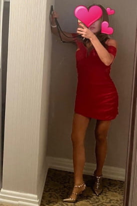 Sexy Asian girl in a red velvet dress and high heels