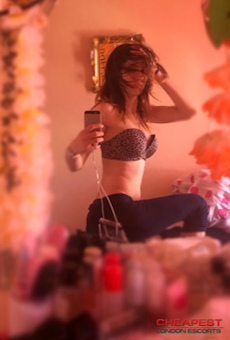 Stylish selfie taken by a sexy escort girl in a mirror