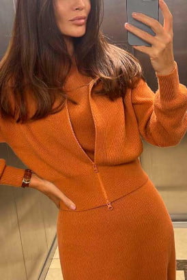 Very elite Spanish girl in an orange dress taking a selfie photo